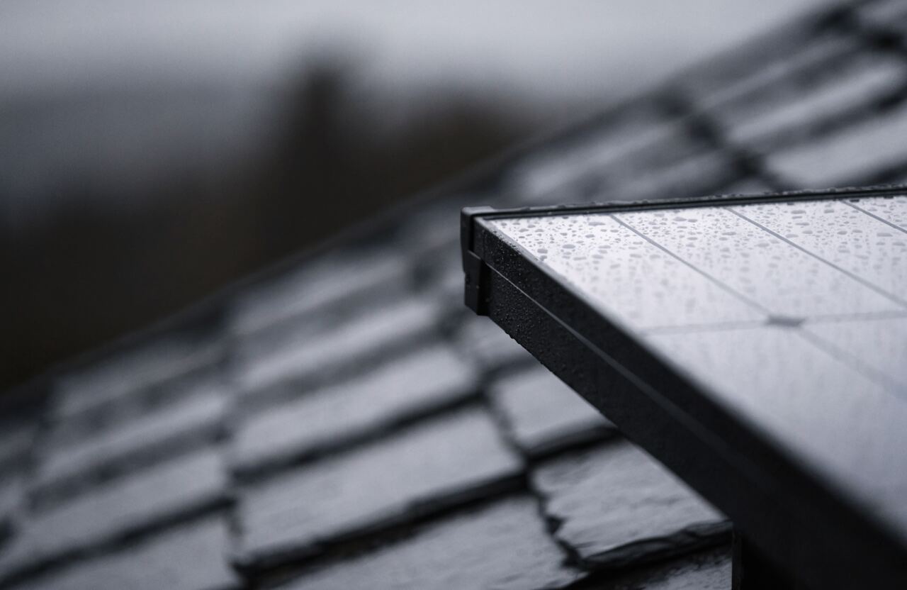 All-black solar panel on a slate roof